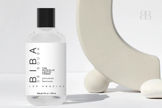 Biba de Sousa Los Angeles Glycolic Lactic Toner bottle shown in a minimalist setting, highlighting gentle chemical exfoliation for smoother, balanced skin