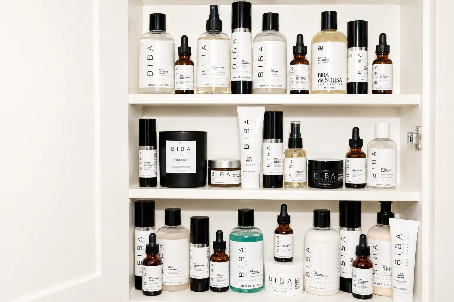 Organized skincare shelf with cleansers, serums, moisturizers, and treatment products after a seasonal spring skincare declutter.