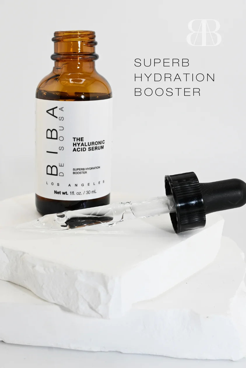 Biba de Sousa Los Angeles Hyaluronic Acid Serum with dropper and clear serum on marble surface, lightweight hydrating serum for skin barrier support and dehydrated skin
