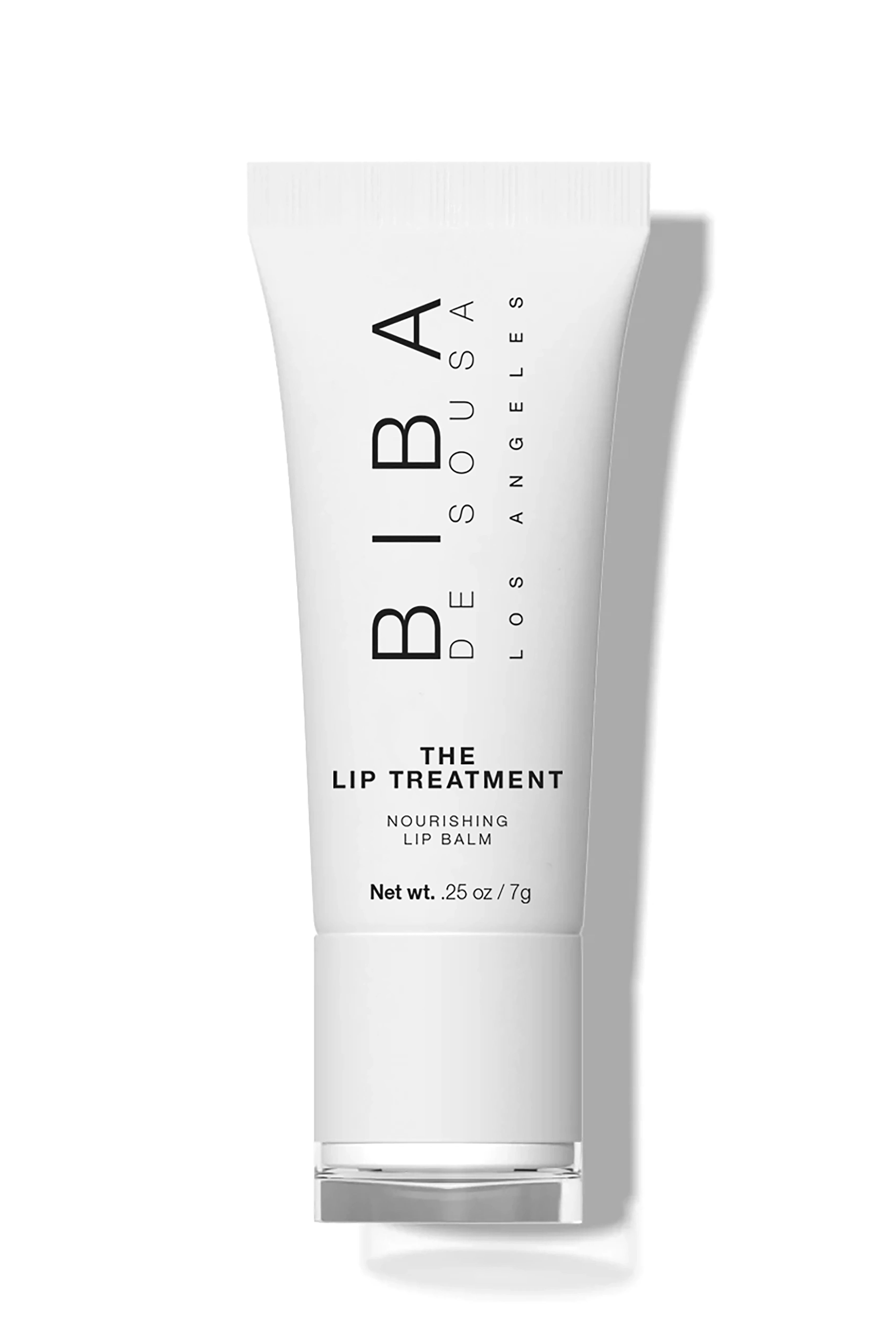 Biba Los Angeles The Lip Treatment nourishing lip balm in a white tube with minimalist black typography on a light gray background.