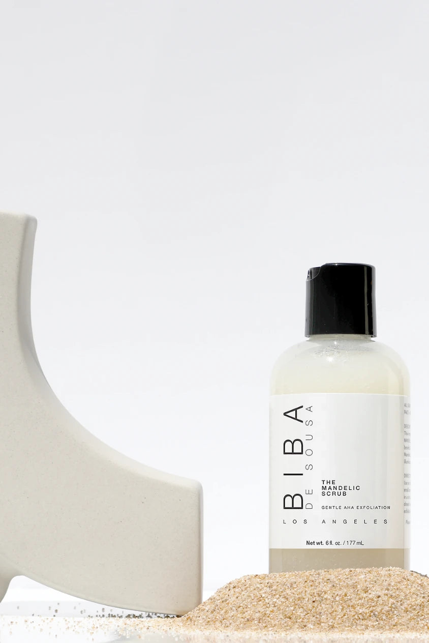 The Mandelic Scrub by Biba Los Angeles, gentle mandelic exfoliating scrub for acne-prone skin with uneven tone, bottle on neutral background