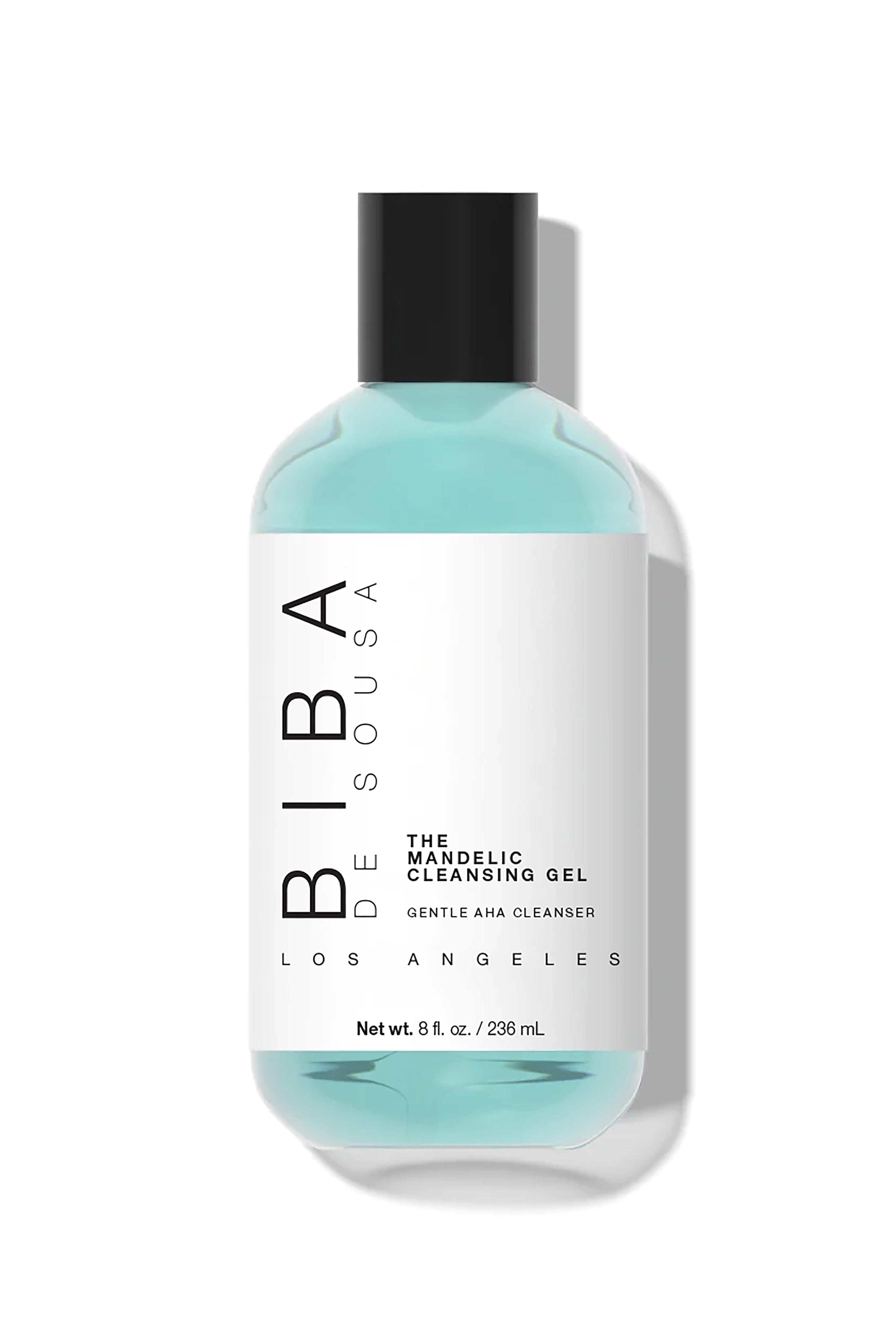 Biba de Sousa Los Angeles Mandelic Cleansing Gel in a clear bottle with light blue gel and black cap, labeled “Gentle AHA Cleanser,” 8 fl oz, photographed on a clean white background.